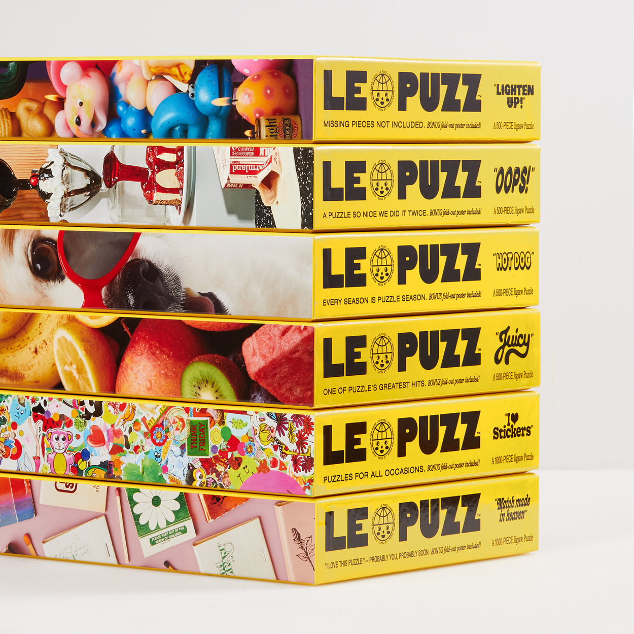 Stack of Le Puzz Puzzle Boxes